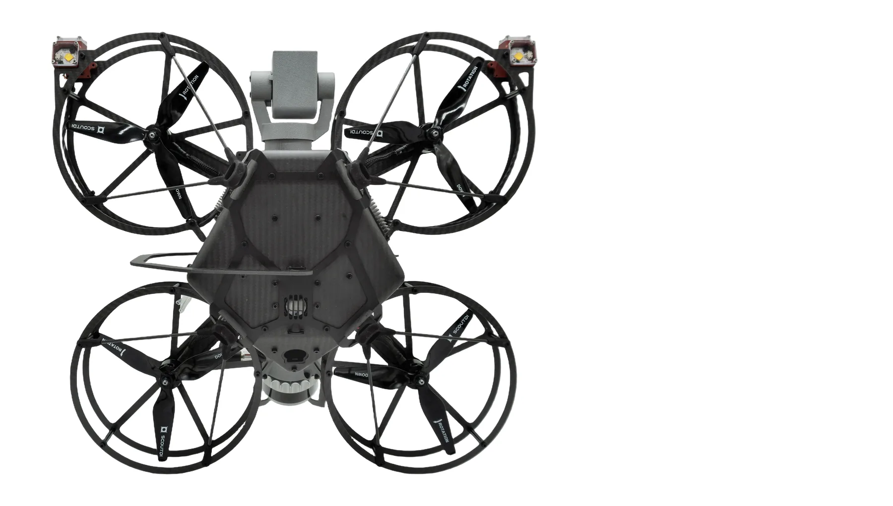 Scout 137 viewed from underneath, showing the carbon-fibre cage, ducted propellers, LED headlights, gimbal-mounted camera, gas-sensor housing in the smartbox, and the tether port