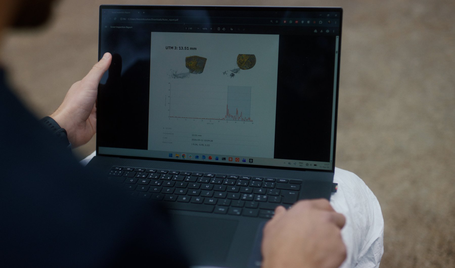 Reviewing the Scout Viewer PDF report with the customer on a laptop, on-site