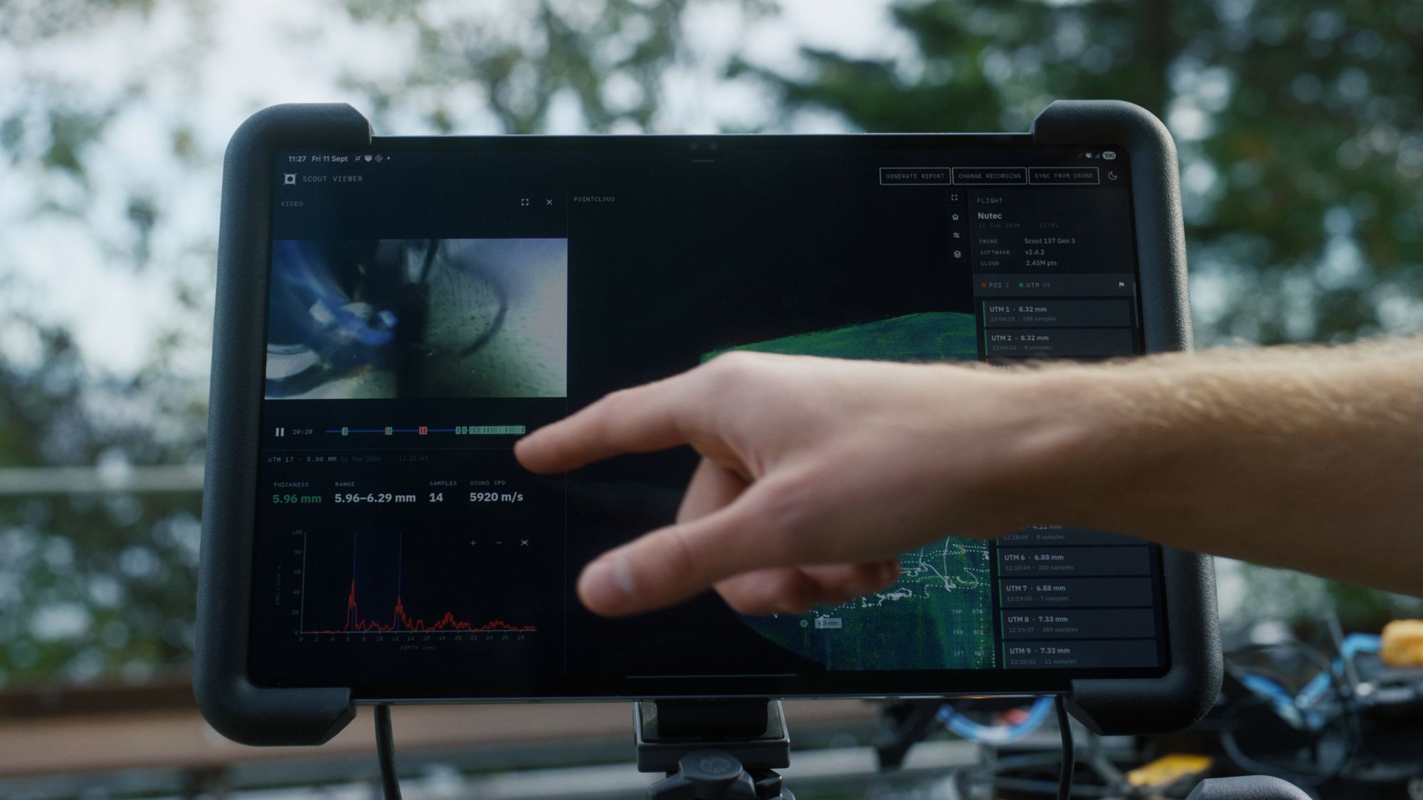 Inspector pointing at the Scout Viewer tablet, showing the video feed, 3D point cloud and UT thickness reading side by side