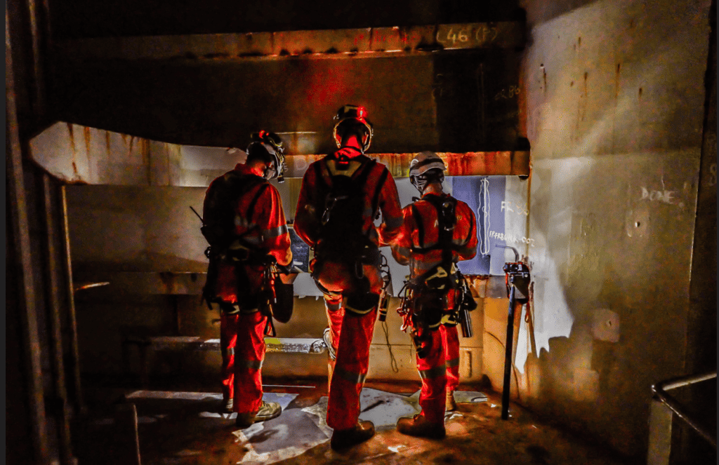 Rope access technicians planning the job Rope access technicians planning the job